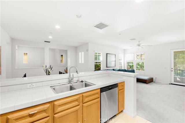 32 Perennial, Irvine, CA 92603 - kitchen featuring stainless steel dishwasher, open floor plan, tile countertops, light carpet, and recessed lighting