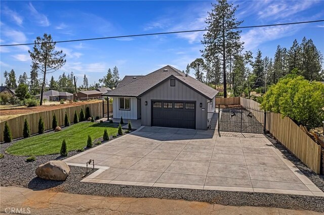 1773 Drendel Cir, Paradise, CA 95969 - modern inspired farmhouse with a garage, concrete driveway, a gate, and board and batten siding