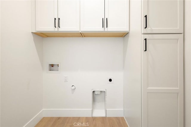 1773 Drendel Cir, Paradise, CA 95969 - laundry room with cabinet space, washer hookup, hookup for an electric dryer, baseboards, and light wood-style flooring