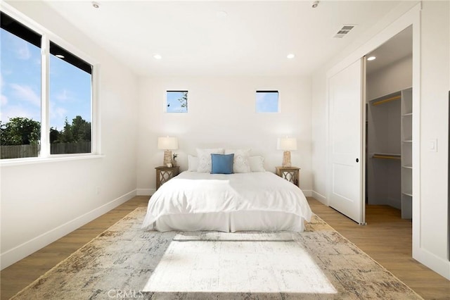 1773 Drendel Cir, Paradise, CA 95969 - bedroom featuring light wood-type flooring, baseboards, a walk in closet, and recessed lighting