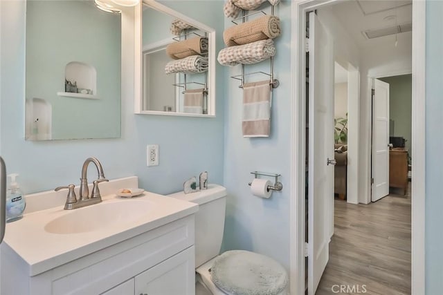 2025 N Buena Vista St, Burbank, CA 91504 - half bathroom featuring wood finished floors, vanity, and toilet