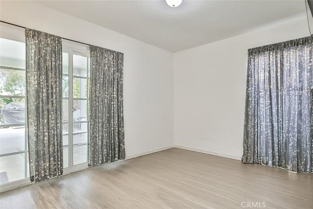 2025 N Buena Vista St, Burbank, CA 91504 - unfurnished room featuring wood finished floors and baseboards