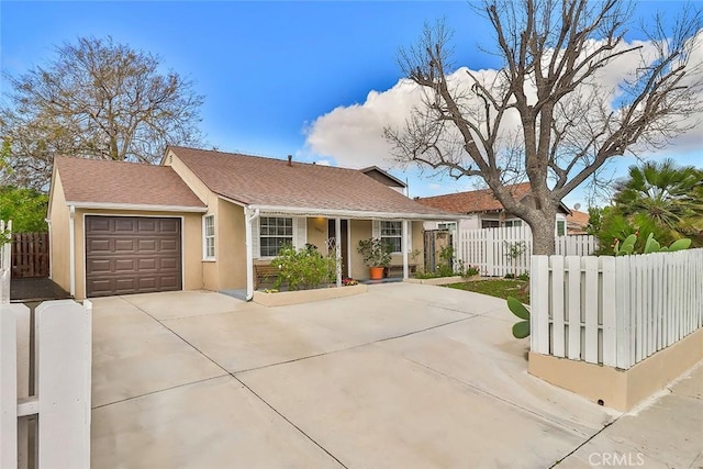 2025 N Buena Vista St, Burbank, CA 91504 - ranch-style home with a garage, driveway, and stucco siding