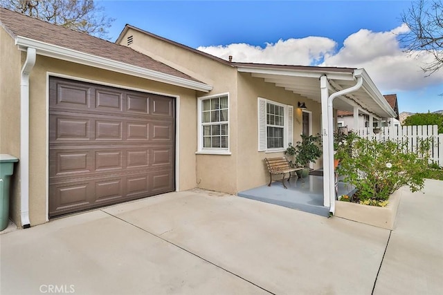 2025 N Buena Vista St, Burbank, CA 91504 - view of front of property with stucco siding, an attached garage, and driveway