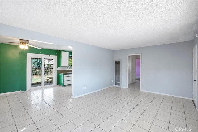 3825 Lofton Pl, Riverside, CA 92501 - spare room featuring a textured ceiling, ceiling fan, baseboards, and light tile patterned floors