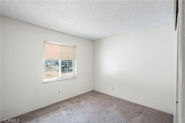 3825 Lofton Pl, Riverside, CA 92501 - carpeted spare room with a textured ceiling
