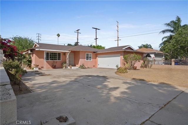 3825 Lofton Pl, Riverside, CA 92501 - single story home with concrete driveway, stucco siding, and a garage