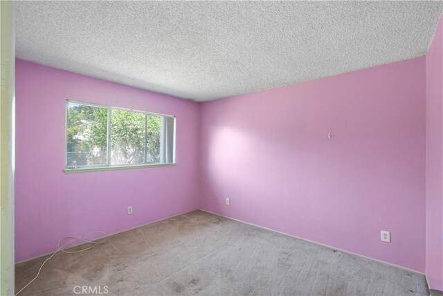 3825 Lofton Pl, Riverside, CA 92501 - carpeted empty room featuring a textured ceiling