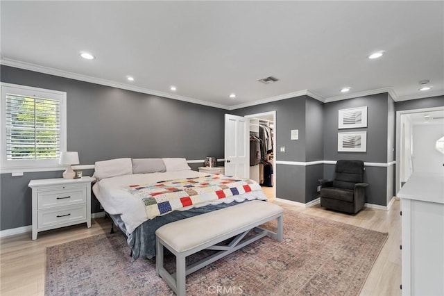 4455 Atoll Ave, Sherman Oaks, CA 91423 - bedroom featuring light wood-type flooring, recessed lighting, a walk in closet, baseboards, and crown molding