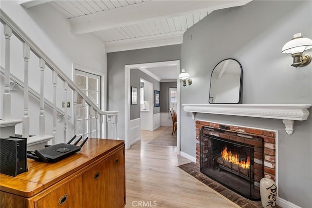4455 Atoll Ave, Sherman Oaks, CA 91423 - office space featuring light wood-type flooring, a brick fireplace, wooden ceiling with exposed beams, baseboards, and ornamental molding