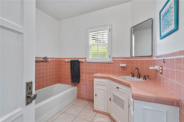 4455 Atoll Ave, Sherman Oaks, CA 91423 - full bathroom with a garden tub, vanity, tile patterned floors, wainscoting, and tile walls