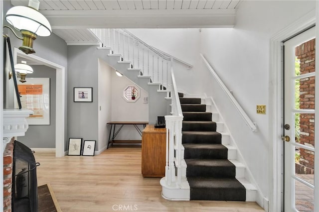 4455 Atoll Ave, Sherman Oaks, CA 91423 - staircase featuring wood finished floors, wooden ceiling with exposed beams, and baseboards