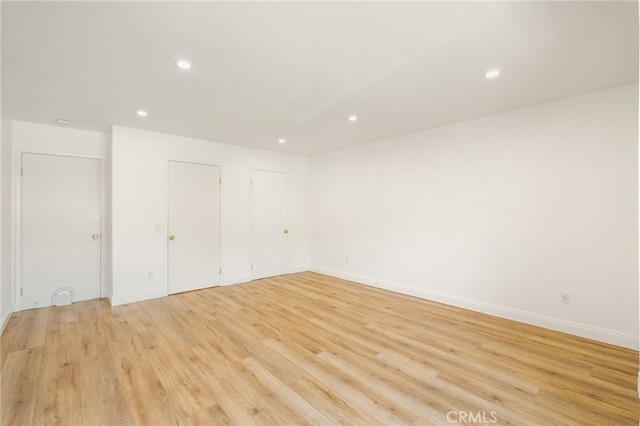 19464 Turtle Ridge Ln, Porter Ranch, CA 91326 - spare room with light wood-style flooring, recessed lighting, and baseboards