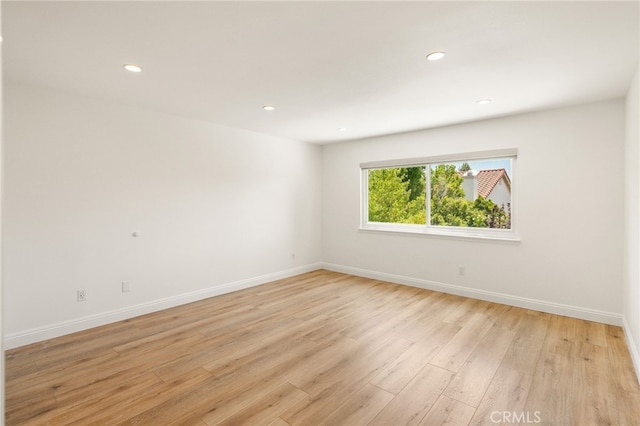19464 Turtle Ridge Ln, Porter Ranch, CA 91326 - unfurnished room with light wood-style floors, recessed lighting, and baseboards