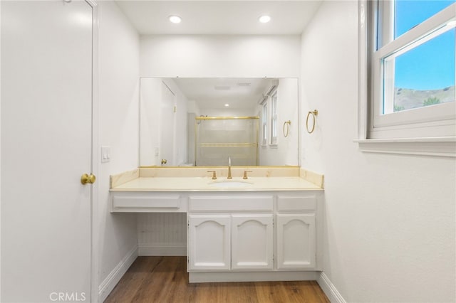 19464 Turtle Ridge Ln, Porter Ranch, CA 91326 - bathroom featuring wood finished floors, baseboards, vanity, a shower with door, and recessed lighting