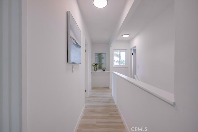 24162 Twig St, Lake Forest, CA 92630 - hallway with baseboards, an upstairs landing, and light wood-style floors