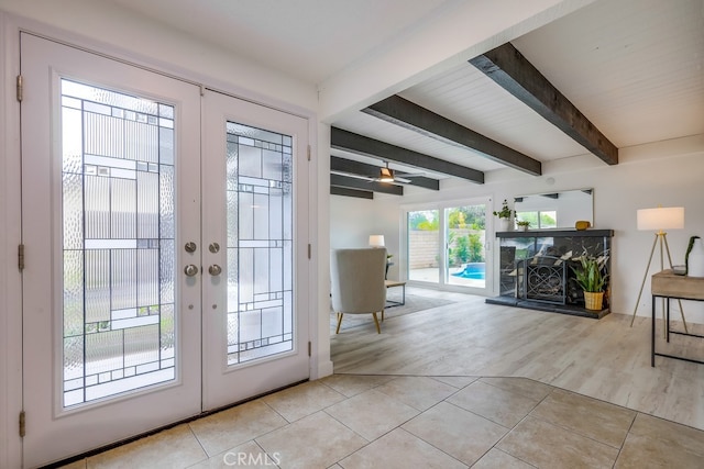 24162 Twig St, Lake Forest, CA 92630 - doorway featuring french doors, beam ceiling, a fireplace with raised hearth, and light tile patterned floors