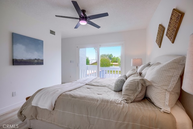 24162 Twig St, Lake Forest, CA 92630 - bedroom featuring access to outside, a textured ceiling, wood finished floors, ceiling fan, and baseboards
