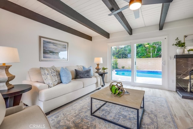 24162 Twig St, Lake Forest, CA 92630 - living area with light wood-style floors, a ceiling fan, and wooden ceiling with exposed beams