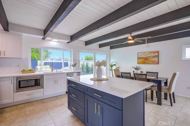 24162 Twig St, Lake Forest, CA 92630 - kitchen with stainless steel appliances, a sink, white cabinetry, light countertops, and beam ceiling