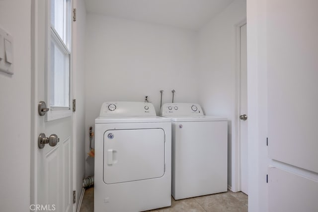 24162 Twig St, Lake Forest, CA 92630 - laundry room with washing machine and dryer and light tile patterned floors