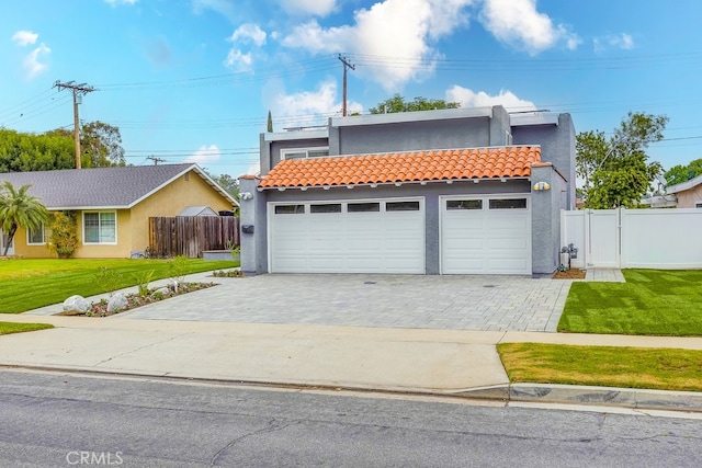 24162 Twig St, Lake Forest, CA 92630 - view of front of house featuring stucco siding, decorative driveway, a tiled roof, and a garage