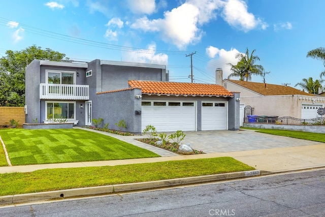 24162 Twig St, Lake Forest, CA 92630 - view of front of property featuring a balcony, stucco siding, a garage, a tiled roof, and driveway