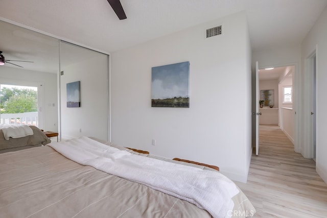 24162 Twig St, Lake Forest, CA 92630 - bedroom with multiple windows, light wood-type flooring, ceiling fan, and baseboards