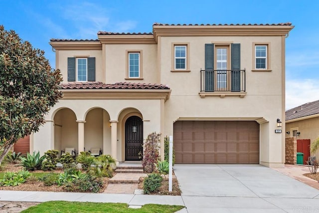 2527 Wellspring St, Carlsbad, CA 92010 - mediterranean / spanish-style home featuring a garage, stucco siding, driveway, a balcony, and a tiled roof