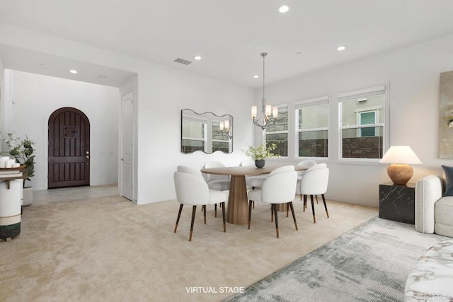 2527 Wellspring St, Carlsbad, CA 92010 - carpeted dining space featuring recessed lighting, a chandelier, and arched walkways