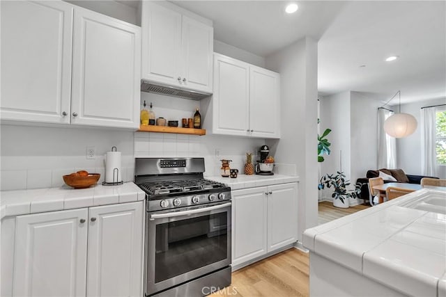 962 Newberry Ln, Claremont, CA 91711 - kitchen featuring stainless steel gas range oven, tile countertops, white cabinetry, and recessed lighting