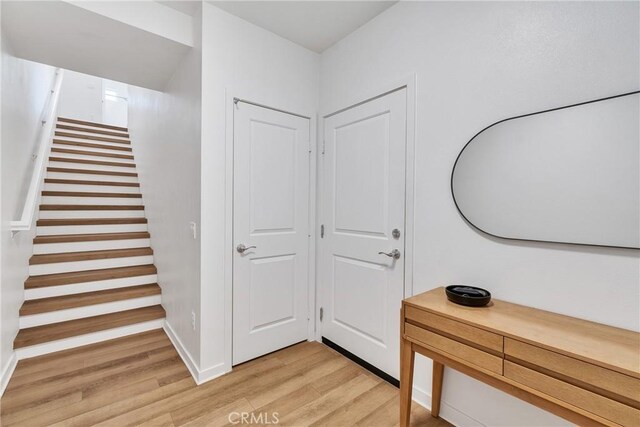962 Newberry Ln, Claremont, CA 91711 - foyer featuring light wood-type flooring and stairs