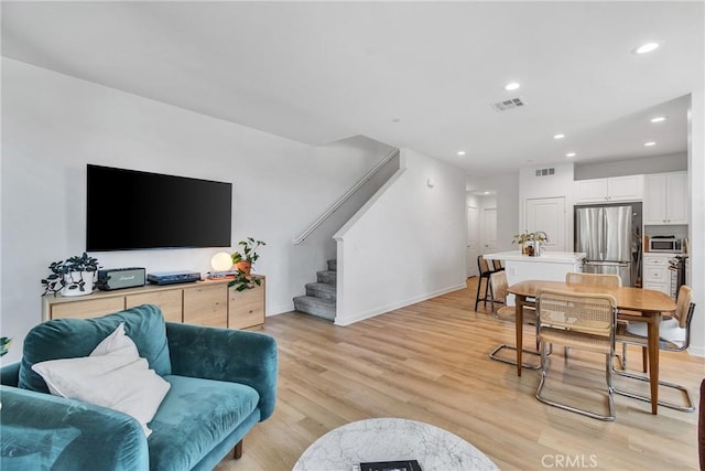 962 Newberry Ln, Claremont, CA 91711 - living room with stairway, light wood-style flooring, and recessed lighting