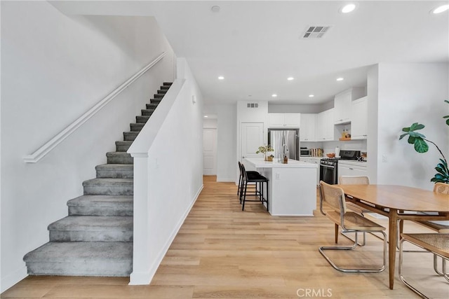 962 Newberry Ln, Claremont, CA 91711 - dining area featuring stairway, light wood-style floors, and recessed lighting