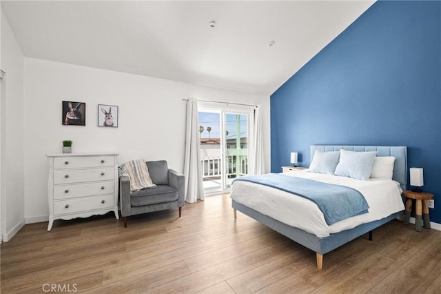 2310 Vanderbilt Ln Unit 4, Redondo Beach, CA 90278 - bedroom featuring access to outside, wood finished floors, and lofted ceiling
