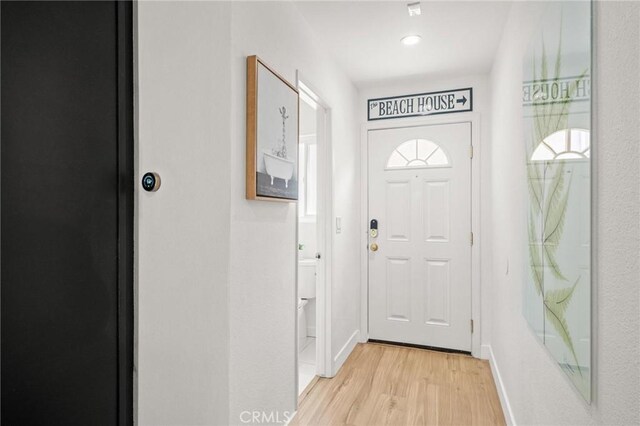 2310 Vanderbilt Ln Unit 4, Redondo Beach, CA 90278 - doorway to outside featuring light wood-style flooring and baseboards