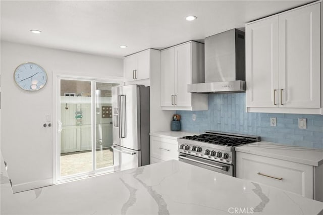 2310 Vanderbilt Ln Unit 4, Redondo Beach, CA 90278 - kitchen featuring high quality appliances, wall chimney range hood, white cabinetry, light stone counters, and tasteful backsplash