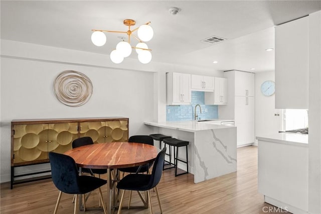 2310 Vanderbilt Ln Unit 4, Redondo Beach, CA 90278 - dining area with a chandelier, light wood finished floors, and recessed lighting