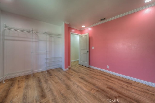 1043 Meadowview Ct, Corona, CA 92878 - unfurnished bedroom with wood finished floors, ornamental molding, a closet, and recessed lighting