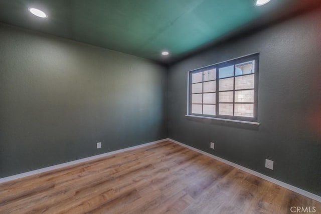 1043 Meadowview Ct, Corona, CA 92878 - spare room with wood finished floors and recessed lighting