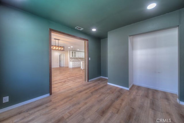 1043 Meadowview Ct, Corona, CA 92878 - empty room with recessed lighting and wood finished floors