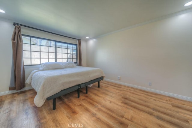 1043 Meadowview Ct, Corona, CA 92878 - bedroom with light wood-type flooring, crown molding, and recessed lighting