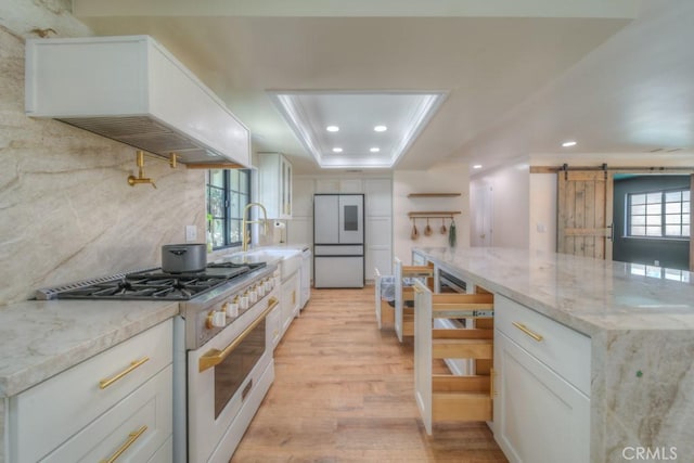 1043 Meadowview Ct, Corona, CA 92878 - kitchen featuring high end white range oven, refrigerator, a barn door, light wood finished floors, and custom exhaust hood