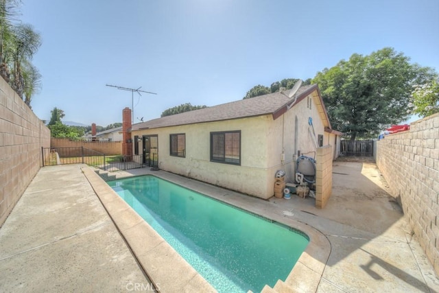 1043 Meadowview Ct, Corona, CA 92878 - view of swimming pool with a fenced backyard and a patio area