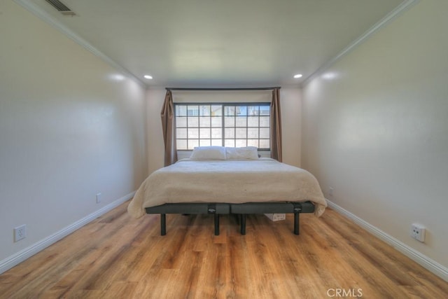 1043 Meadowview Ct, Corona, CA 92878 - bedroom with crown molding, recessed lighting, and wood finished floors