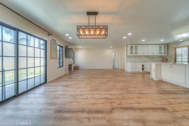 1043 Meadowview Ct, Corona, CA 92878 - unfurnished living room featuring recessed lighting and light wood-type flooring
