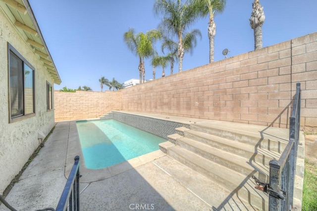 1043 Meadowview Ct, Corona, CA 92878 - view of swimming pool featuring a fenced backyard and a patio