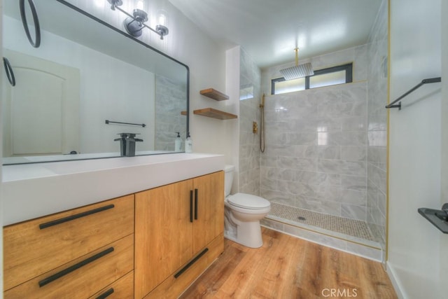 1043 Meadowview Ct, Corona, CA 92878 - bathroom with a tile shower, vanity, and wood finished floors