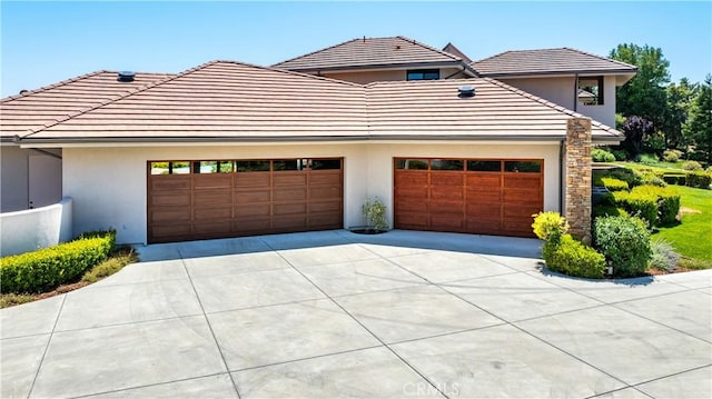 2340 Battering Rock Rd, Templeton, CA 93465 - view of front of home featuring concrete driveway, stucco siding, a garage, and a tiled roof