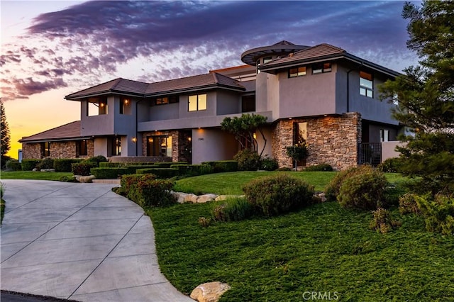 2340 Battering Rock Rd, Templeton, CA 93465 - prairie-style home with stone siding, stucco siding, and a front lawn